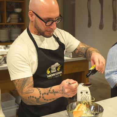 guests-adding-ingrediants-to-one-of-our-delicious-dishs-in-hands-on-pasta-making-and-gelato-cooking-class Fresh ingredients being added during a shared hands-on pasta making and gelato class in Rome