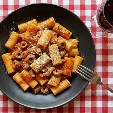 close-up-to-the-rigatoni-alla-pajata-in-a-roman-trattoria close up to the rigatoni alla pajata in a roman trattoria