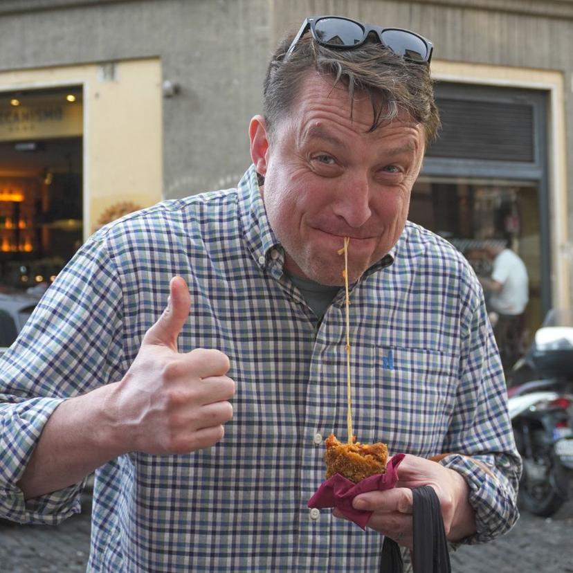 first-bite-of-roman-suppli-during-a-trastevere-food-tour-with-inrome-cooking First bite of a Roman Supplì during a Trastevere Food Tour with InRome Cooking