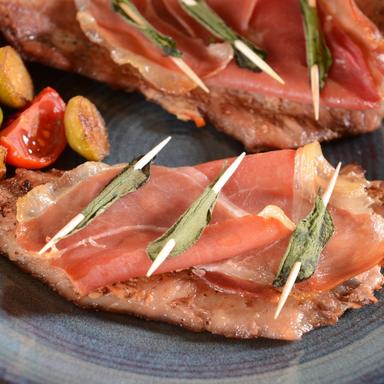 Traditional saltimbocca alla Romana made with veal, prosciutto crudo and fresh sage, a classic Roman second course