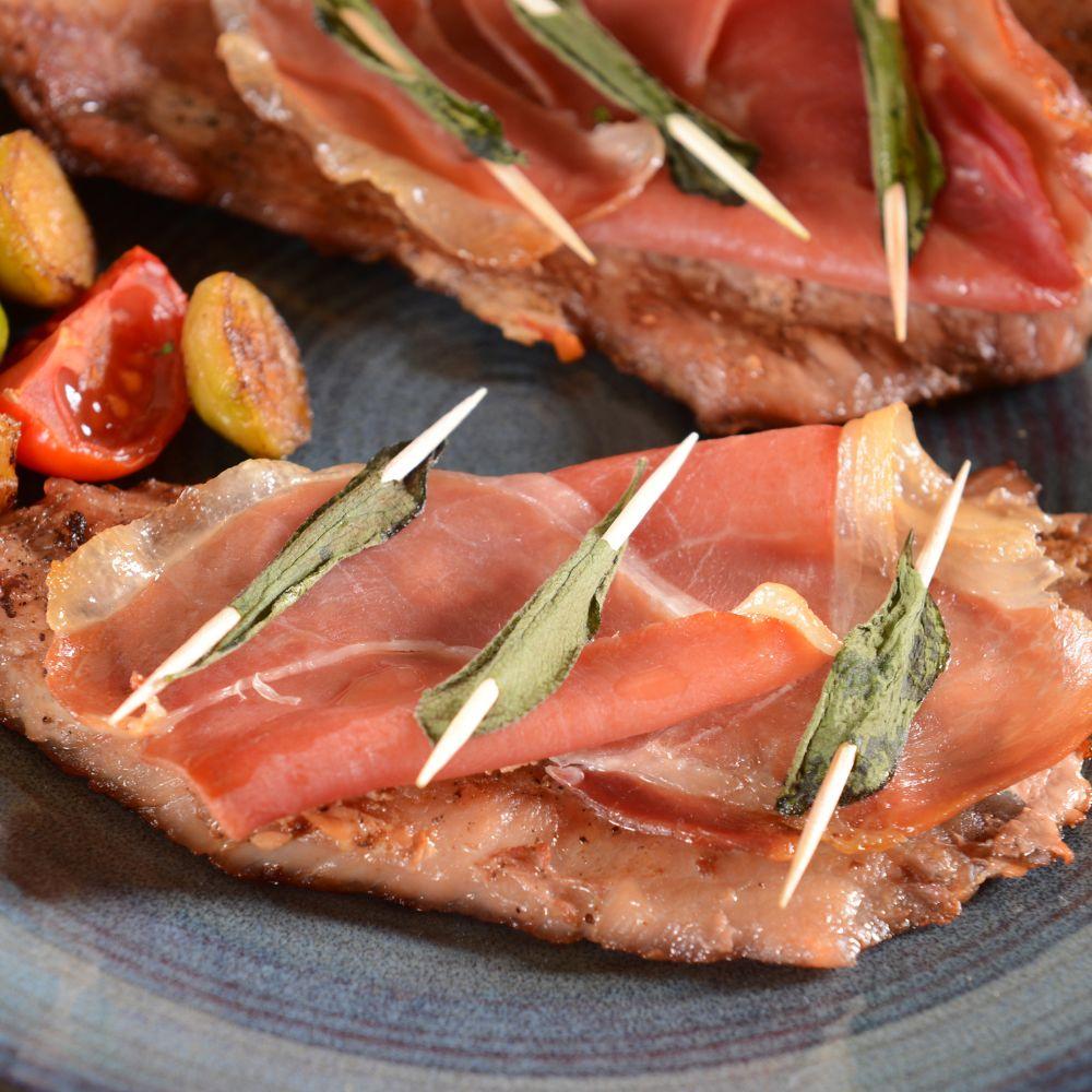 Traditional saltimbocca alla Romana made with veal, prosciutto crudo and fresh sage, a classic Roman second course