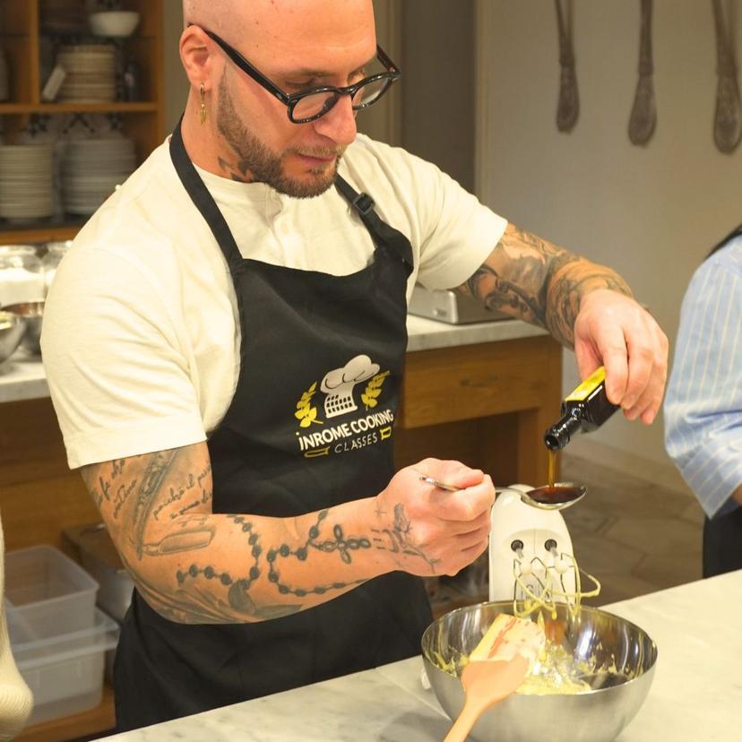 Guest Preparing Fresh Pasta Fresh ingredients being added during a shared hands-on pasta making and gelato class in Rome
